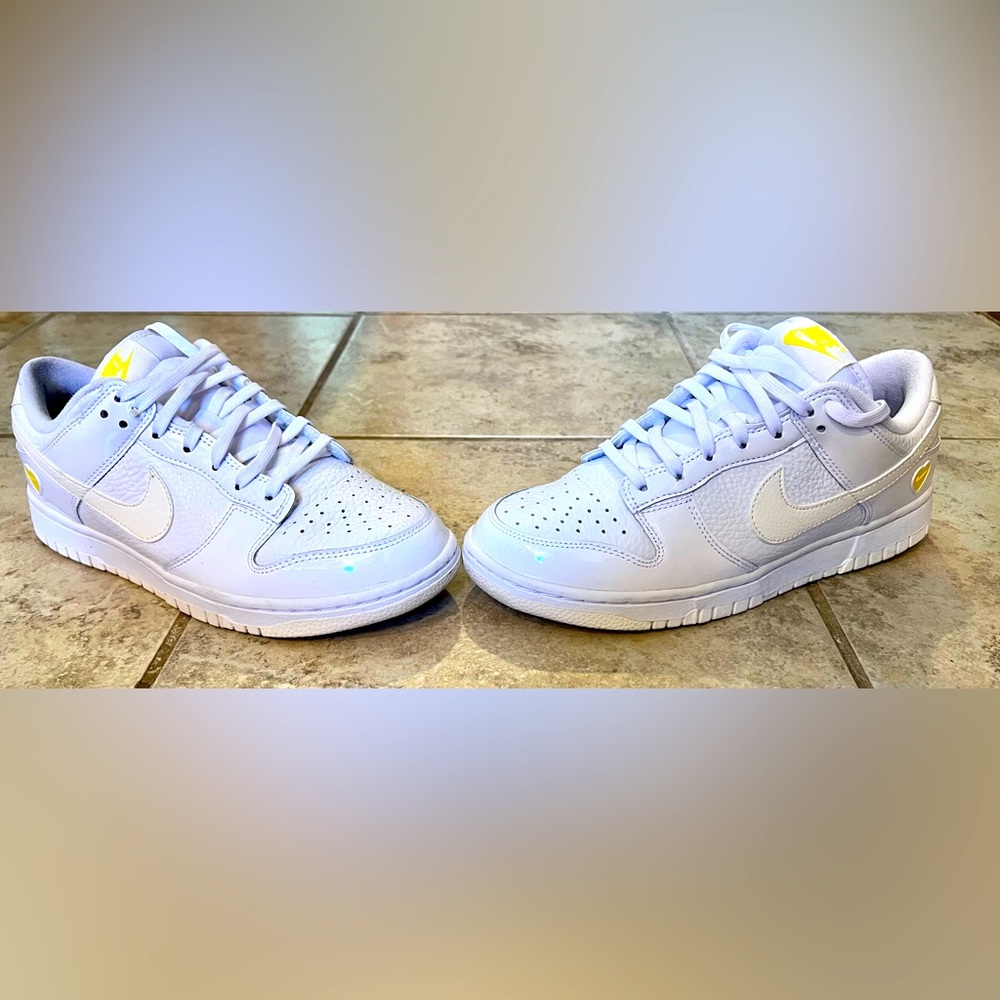 Nike Women’s Dunk Low Shoes with yellow accents. Size 7. Worn only once.